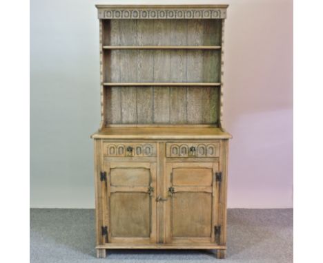 A light oak dresser, with thumbnail decoration, 95cm