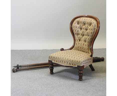 A Victorian floral upholstered button back nursing chair, together with two wooden curtain poles, each approximately 160cm