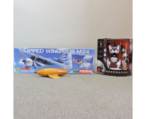 A model aeroplane, boxed, together with a pond yacht and a toy robot
