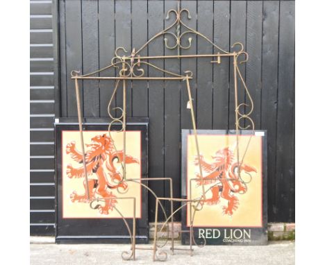 A vintage iron sign frame, 237cm high, together with another smaller and two red lion signs (4)
