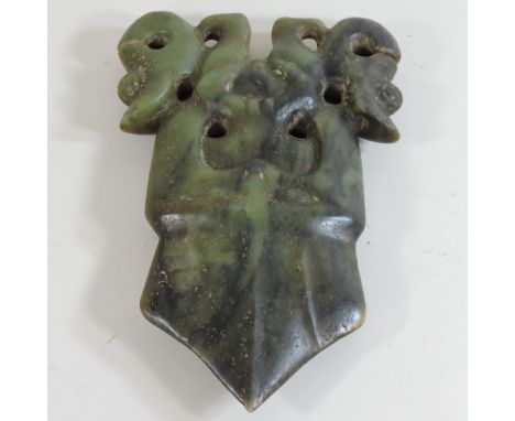 A jade coloured carving of a deity, 22cm high