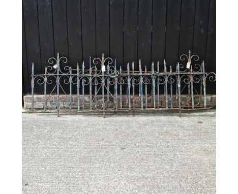 An ornate wrought iron railing,167 x 65cm, together with two others smaller 