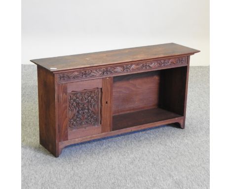 An Edwardian carved walnut wall shelf, 74cm