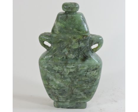 A jade coloured stone vase and cover, 17cm high