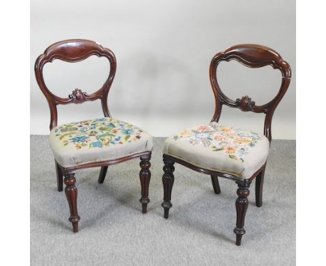 A set of four Victorian mahogany balloon back dining chairs, with tapestry seats