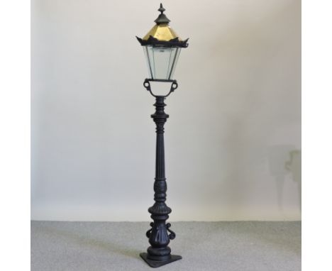 A Victorian style black painted metal lamp post, 190cm high