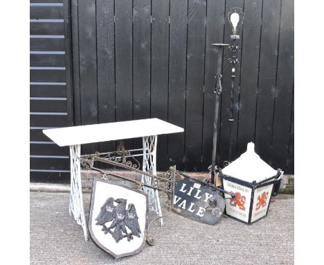 A vintage Barclay's bank sign, together with two other signs, a wrought iron standard lamp, another and a marble top table, 9