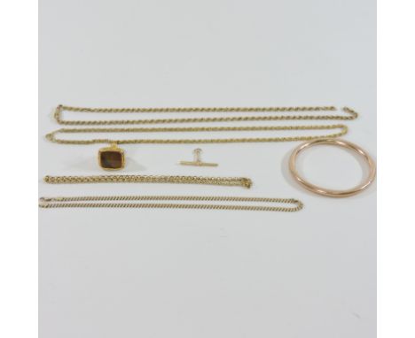 A 9 carat gold necklace, together with another, a Victorian gold plated and hardstone pocket seal and a bangle