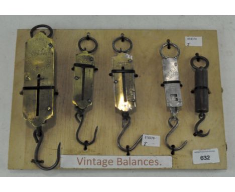 A group of five balance scales, including Salters no 2, Hughes pocket balance