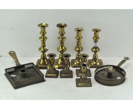 Four sets of brass candlesticks all on square bases, together with two candlestick holders with pierced decoration to the edg