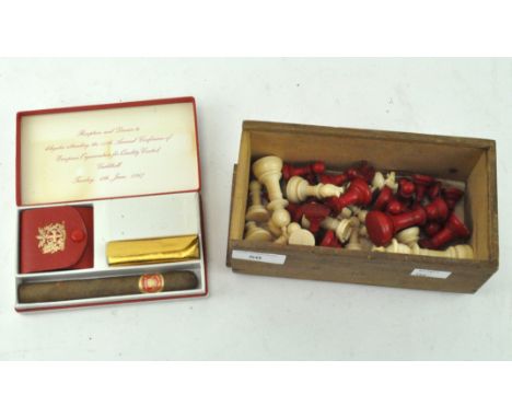 An ivory chess set, 1920s, in white and red, complete, within a wooden sliding box stamped 'Chessmen' height of king 7.5cm, t