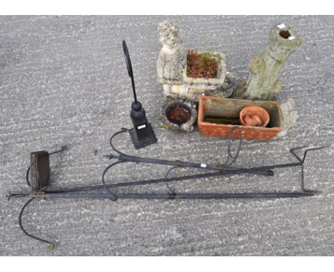 Various garden ornaments and pots, to include a pot in the form of a child pushing a wheelbarrow, a small squirrel, a pillar 