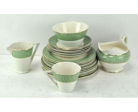 A Wedgwood &amp; Co dinner service in the 'Garden' pattern, comprising cups, saucers, two jugs, bowl and two sets of plates