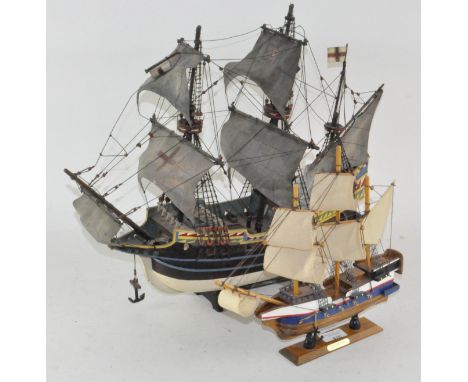 Two wooden model ships, each with two masts, both titled "the Golden Hind", largest 44cm high