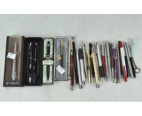 A selection of vintage pens, including a Parker fountain pen and many other examples