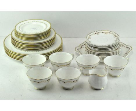 A Royal Doulton tea service in the 'Strasbourg' pattern, together with a set of Royal Doulton graduated plates in the 'Coving