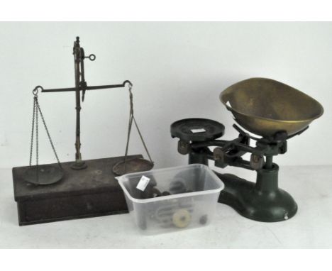 A set of vintage Thomas Plant kitchen scales in green with brass weights and tray; together with another set of scales on a w