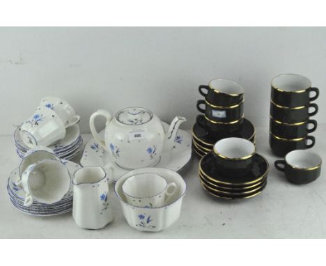 A Victoria six piece tea service, including cups and saucers, teapot, sugar bowls and milk jug, decorated with blue flowers; 
