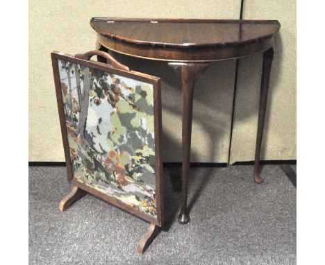 A demi-lune hall table, 73cm x 75cm x 38cm; together with an oak framed tapestry fire screen