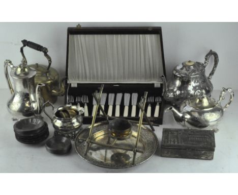 A selection of silver plated wares, to include a tea set, coffee pot, fish knives in canteen, brass teapot on stand and more