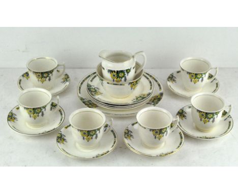 A Crownford Art Deco style part tea service, with green and yellow floral decoration