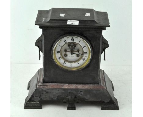 A slate mantel clock the dial inscribed Hry Marc Paris with exposed escapement