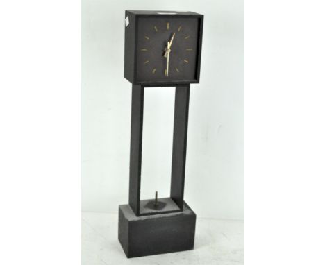 A contemporary slate cased mantel clock, modern, with quartz movement on a square base, 52 cm high