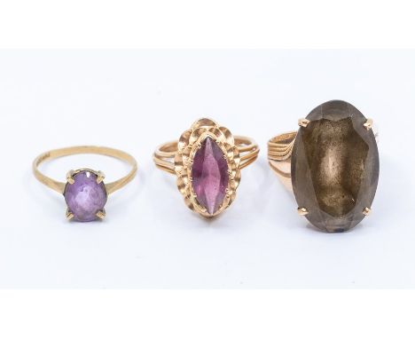 A collection of three gold stone set rings, to include a smoky quartz 14ct gold ring, size P and a 14ct gold and paste set 14