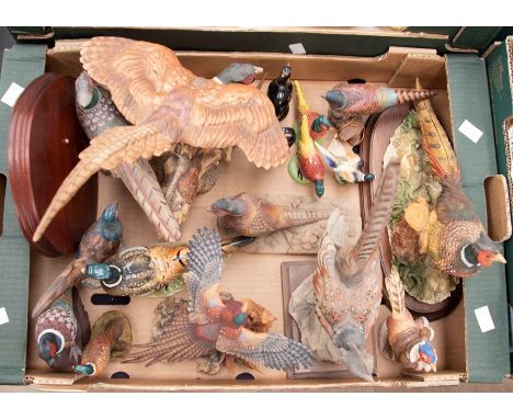 A Beswick model of a pheasant together with a group of ceramic, resin and wooden pheasants to include Scottish Borders figure