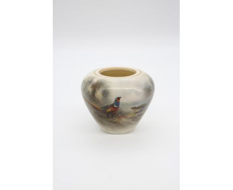 A Royal Worcester ovoid vase, shape no: G210, the body painted with a pair of Pheasants, gilt heightened, green mark, date co