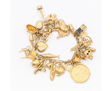 A 9ct gold charm bracelet including various charms, sovereign dated 1910, poodle, cat, harp fish etc, total gross weight appr