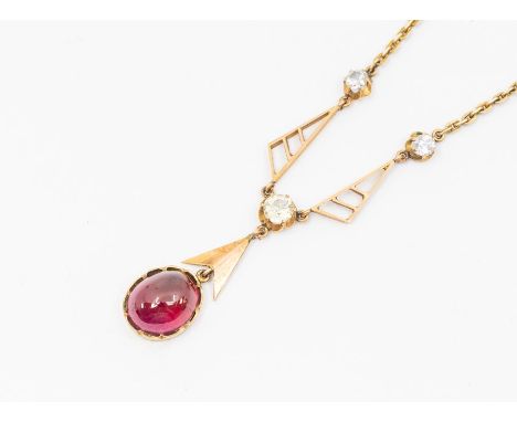 An early 20th century garnet and quartz yellow metal necklace, comprising an oval cabochon garnet drop, approx 12 x 9mm, with