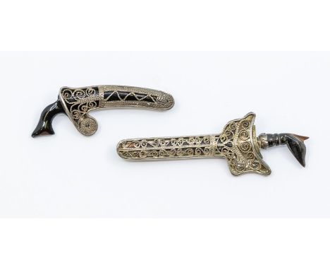Two vintage Malaysian/Indonesian filigree and horn kris brooch, unmarked white metal Condition report: wear and tear commensu