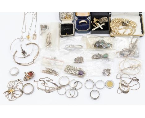 A collection of silver and white metal jewellery to include stone set pendants, chains, rings, bangle, a Titanium ring etc.