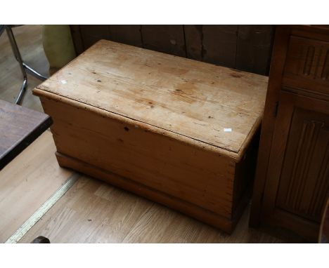 A Victorian pine travelling trunk, with carrying handles to sides, 45cm high, 90cm wide, 49cm deep