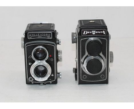 Vintage Rolleicord camera, no lense caps along with similar Del Monta with lense caps.