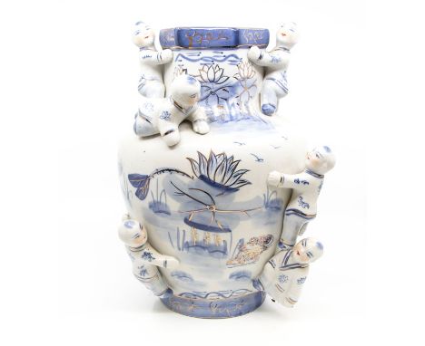 A modern Chinese blue and white vase applied with figures climbing, the body painted water flowers, gilt heightened, hexagona