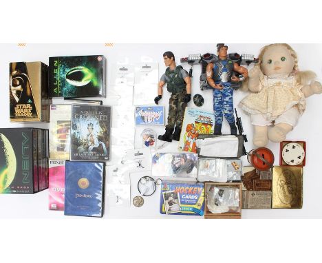 A collection of assorted curios to include Action Man figures, badges, DVDs and others. (one box)