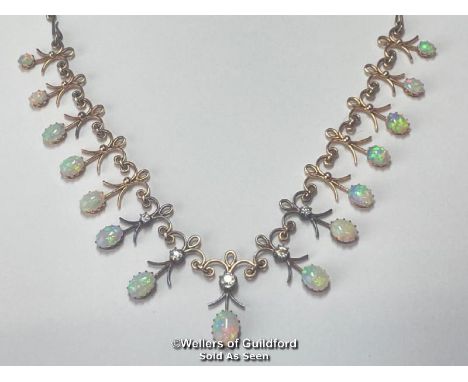 Early 20th Century opal and diamond fringe necklace with fifteen oval opals measuring approx. 8x6mm to 4x3mm, five old cut di