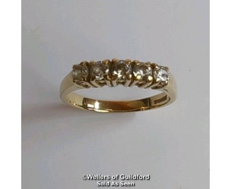 Five stone cubic zirconia ring in hallmarked 9ct gold. Diameter of stones 3.2mm. Ring size R1/2. Gross weight 3.25g 