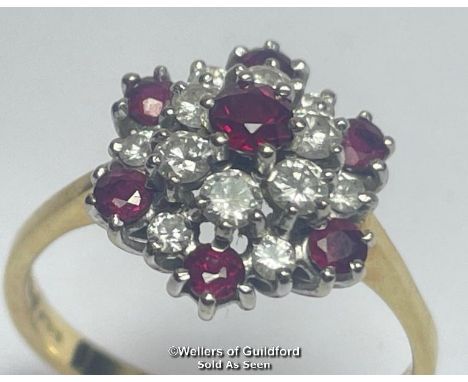 Ruby and diamond double cluster ring in 18ct gold. Total diamond weight estimated as 0.50g, colour H, clarity SI. Total ruby 