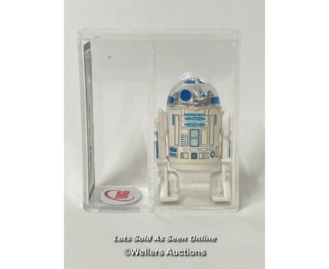 Star Wars vintage R2-D2 (solid dome) 3 3/4" figure, HK , 1977, UKG graded 70% , figure 75, paint 70, slightly torn at the sti