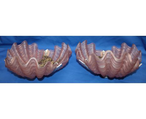 A pair of 1930s Art Deco chromium plated hanging ceiling light shades with pink tinted glass clam shell mounts