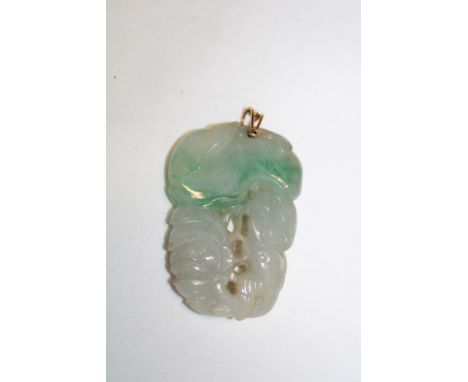 An Eastern carved jade pendant in the form of a blossoming flower, 1¾" long