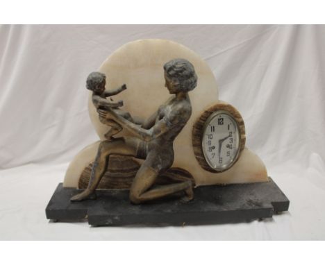 An unusual French Art Deco mantel clock with oval dial set in a cream and brown marble cloud mount supported by a gilt spelte