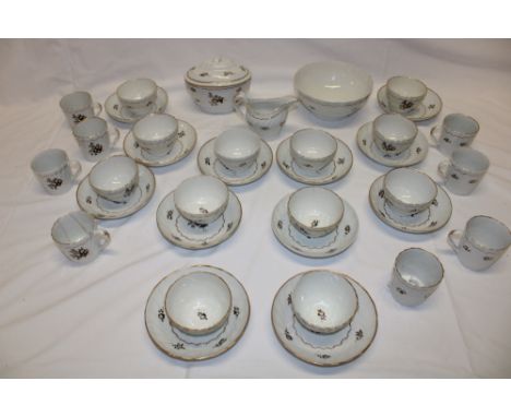 A late 18th/early 19th century china part tea set with floral and gilt decoration comprising 12 tea bowls, 8 cups, 11 saucers