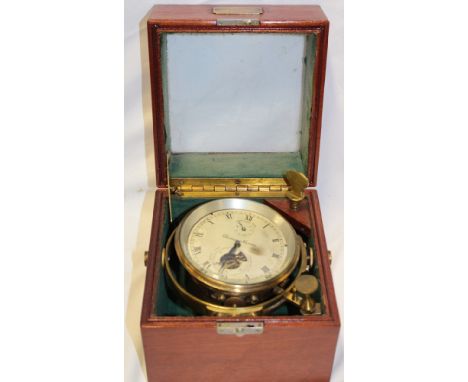 A good quality brass marine chronometer by Thomas Mercer with silvered dial in mahogany glazed baize-lined gimbled case suppl