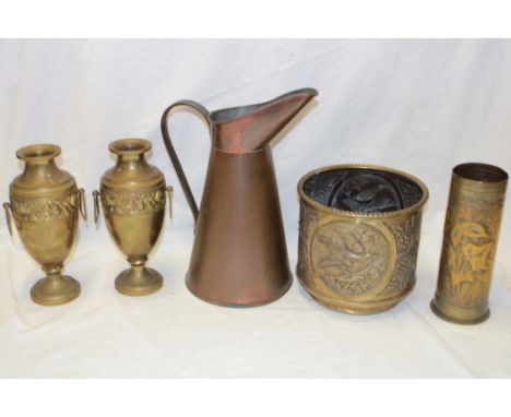A pair of brass ornamental baluster-shaped two handled vases with raised floral decoration, 9½" high; brass circular planter 