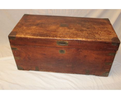 An old brass mounted teak rectangular trunk with hinged lid and brass handles, 36" long