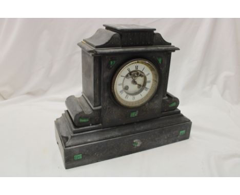 A Victorian mantel clock with enamelled circular part visible escapement in black slate traditional case inlaid with malachit